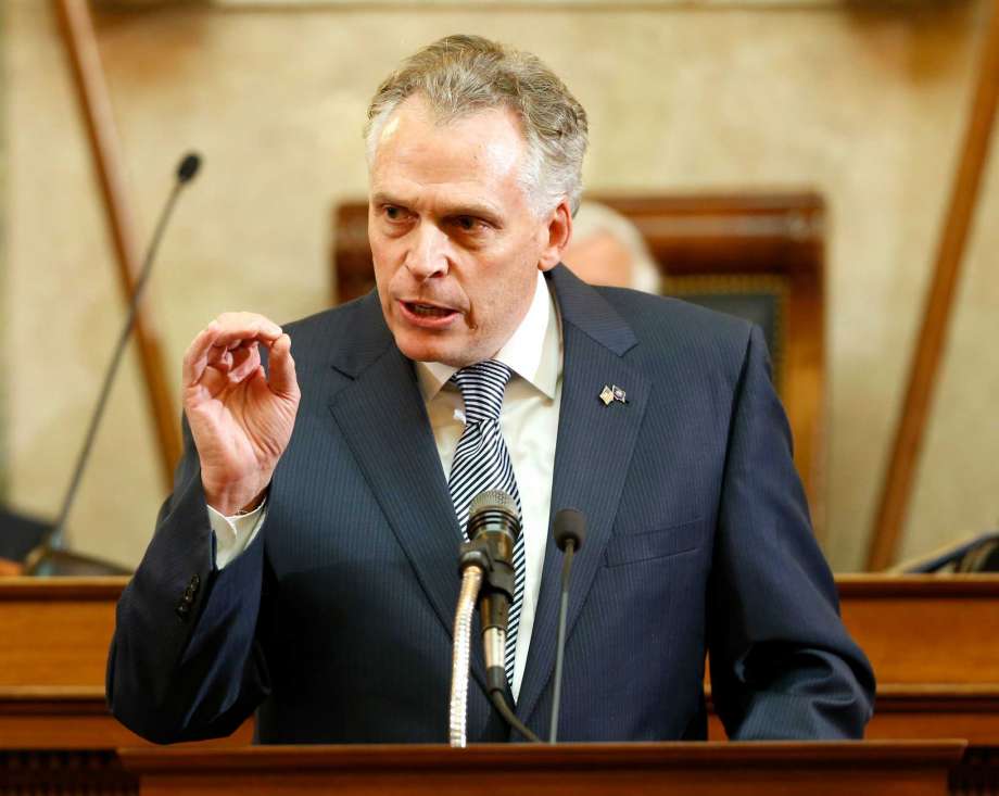 Virginia Gov. Terry Mc Auliffe gestures as he delivers his State of the Commonwealth Address before a joint session of the 2016 Virginia Assembly at the Capitol in Richmond Va. A U.S. law enforcement official says