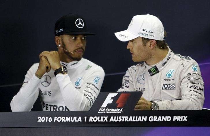 Formula One- Australia Grand Prix- Melbourne Australia- 20/03/16- Australian Formula One Grand Prix winner Mercedes F1 driver Nico Rosberg speaks with team mate Lewis Hamilton at the post-race press conference in Melbourne. REUTERS  Brandon Malon