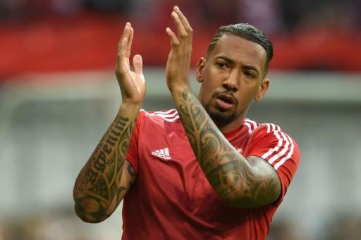 Merkel s spokesman slams racist slur on Germany star Boateng