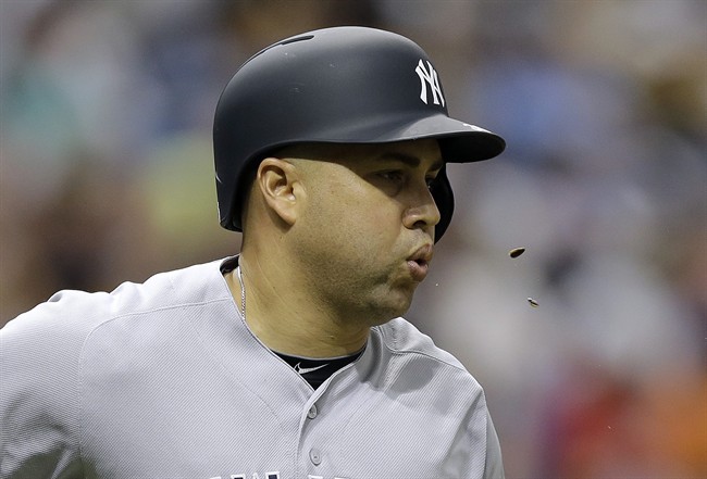 New York Yankees Carlos Beltran spits sunflower seeds as he runs the bases after his home run off Tampa Bay Rays starting pitcher Matt Moore during the fourth inning of a baseball game Saturday