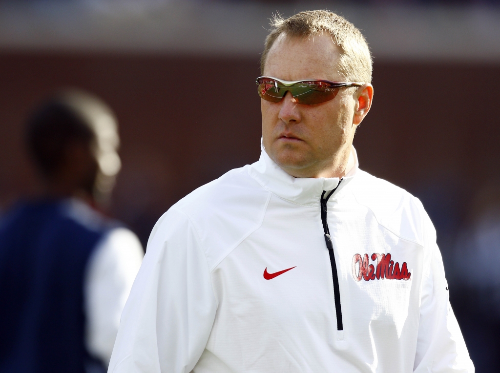 Mississippi football coach Hugh Freeze looks down field toward Mississippi State as they warm up prior to their NCAA college football game in Oxford Miss. Saturday Nov. 29 2014