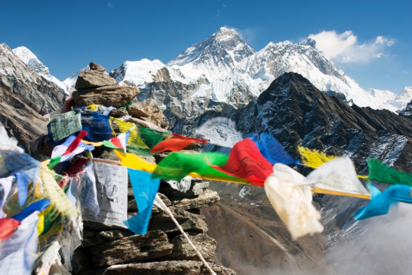 View of Everest from Gokyo Ri in Nepal with prayer flags