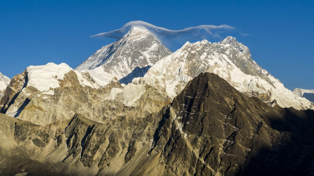 Mount Everest with a white cloud on top is seen from Gokyo Ri at sunset