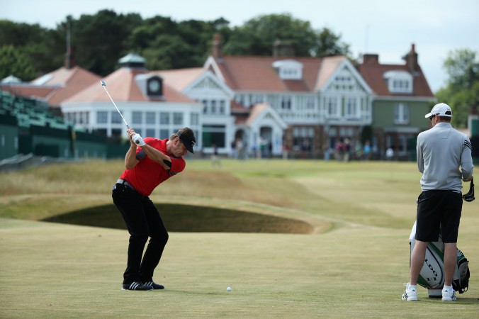 Sir Nick Faldo of England hits a shot on the 18th hole ahead of the 142nd Open Championship at Muirfield