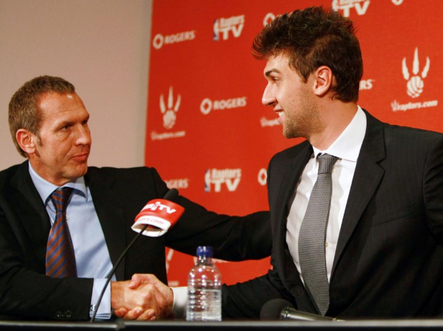 Then-Raptors GM Bryan Colangelo shakes hands with Andrea Bargnani in 2009 after signing him to a three-year extension. Colangelo took Bargnani with the first overal draft pick in 2006