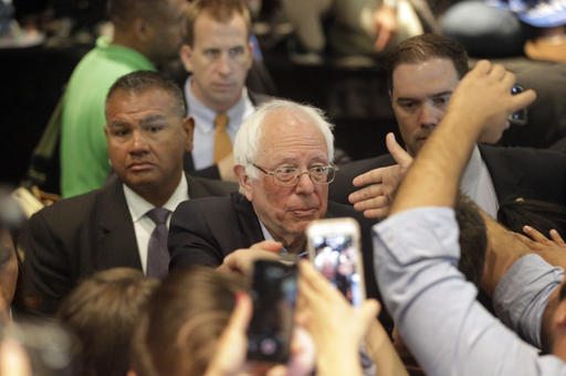 Democratic presidential candidate Sen. Bernie Sanders I-Vt. shakes hands with supporters after speaking at a rally Tuesday in Anaheim