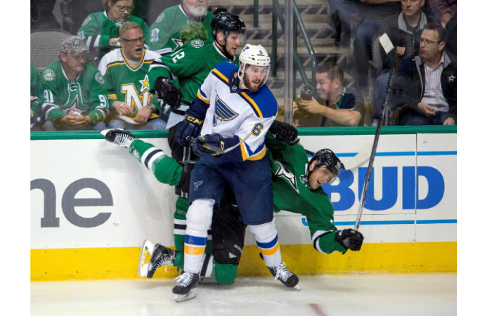 St. Louis Blues’ defenseman Joel Edmundson checks Dallas Stars’ center Radek Faksa and right-wing Ales Hemsky during the third period in Game One of the second round of their Stanley Cup playoffs at the American Airlines Cent