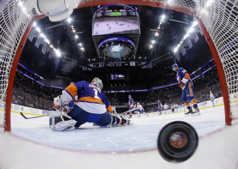 Getty  AFP  Bruce Bennett An overtime goal by Jason Garrison of the Tampa Bay Lightning against Thomas Greiss of the New York Islanders gives them the win and a 3-1 series lead in the Eastern Conference Second Round