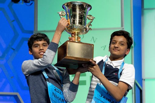 Nihar Janga 11 of Austin Texas and Jairam Hathwar 13 of Painted Post N.Y. hold up the trophy after being named co-champions at the 2016 National Spelling Bee in National Harbor Md. on Thursday