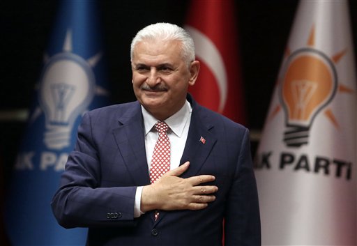 Binali Yildirim Turkey's current Transportation Minister and founding member of the AKP Turkey’s governing party salutes during a meeting in Ankara Turkey Thursday