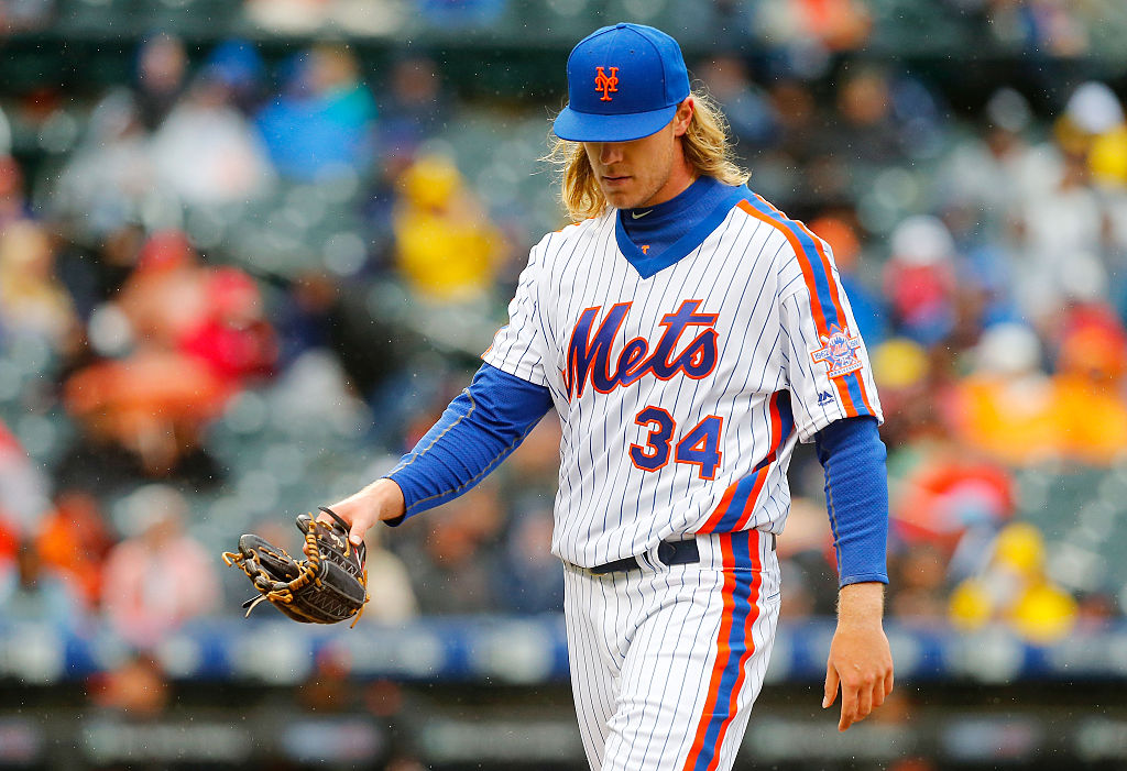 Noah Syndergaard #34 of the New York Mets walks to the dugout after the fifth inning