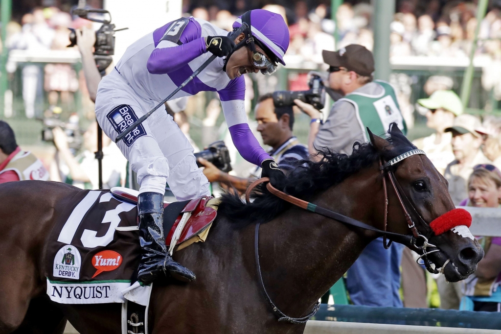 APTOPIX Kentucky Derby Horse Racing Mario Gutierrez celebrates after riding Nyquist to victory during the 142nd running of the Kentucky Derby on Saturday at Churchill Downs in Louisville Ky