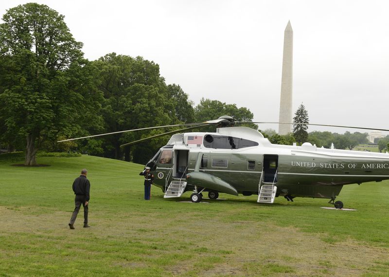 U.S. President Barack Obama walks to Marine One helicopter as he departs the White House for his week-long trip to Japan and Vietnam