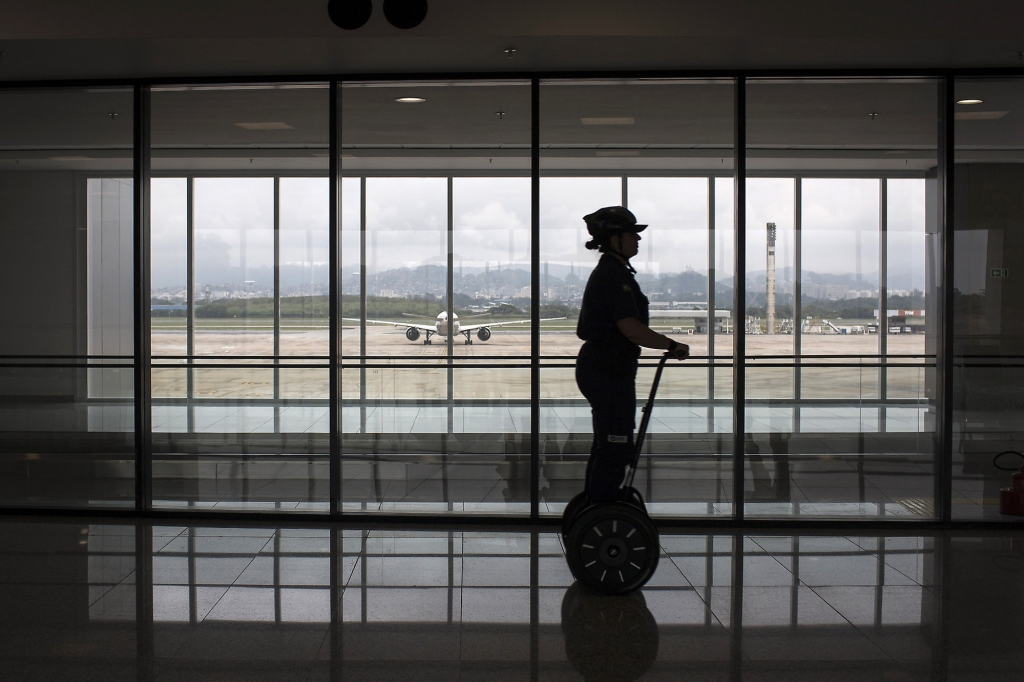 A security worker rides a Segway inside the new area of Terminal 2 at Tom Jobim International Airport in Rio de Janeiro Brazil Thursday