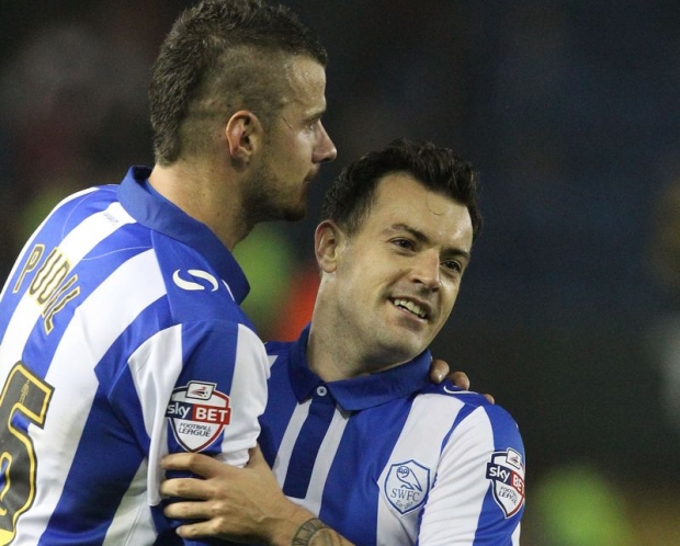 Sheffield Wednesday's Daniel Pudil hugs fellow midfielder Ross Wallace after the English League Cup match against Arsenal in Sheffield