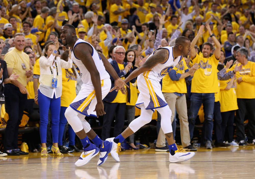 Draymond Green and Andre Iguodala celebrate the Warriors triumph in the second game against the Portland Trail Blazers