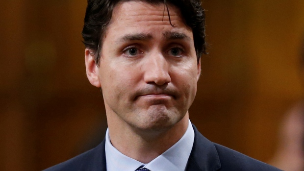 Canada's Prime Minister Justin Trudeau pauses while responding to questions after delivering an apology in the House of Commons on Parliament Hill in Ottawa on Thursday