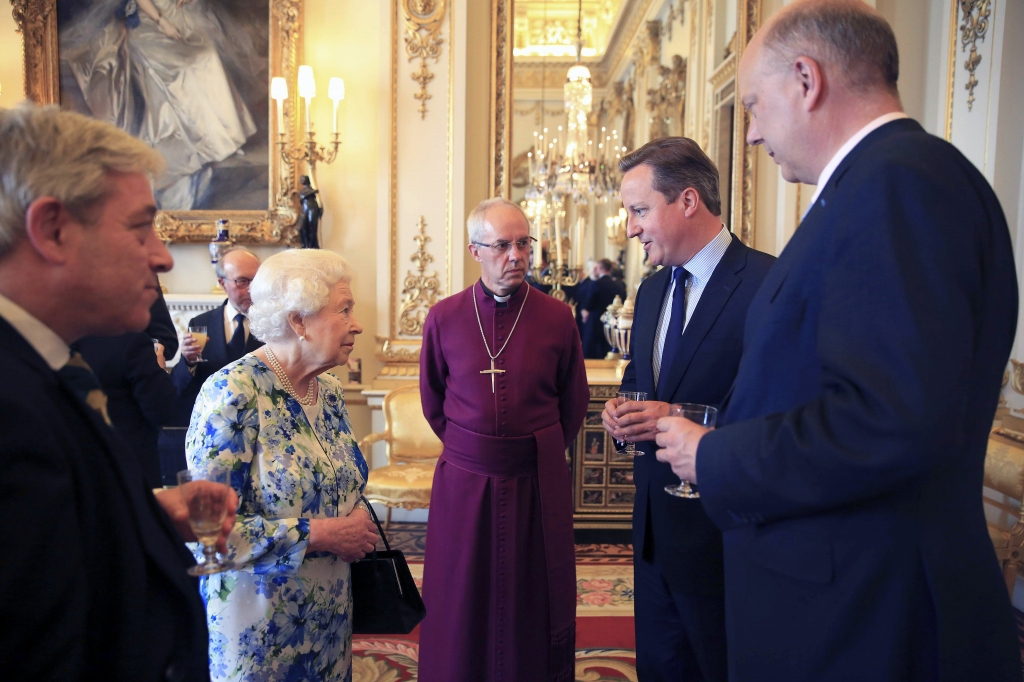 Britain's Queen Elizabeth second left speaks with Prime Minister David Cameron second right as leader of the House of Commons Chris Grayling right and Archbishop of Canterbury Justin Welby center watch during a reception in Buckingham Palace