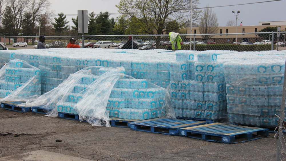 Pallets of bottled water standing in a lot across the street from the venue of Obama’s speech