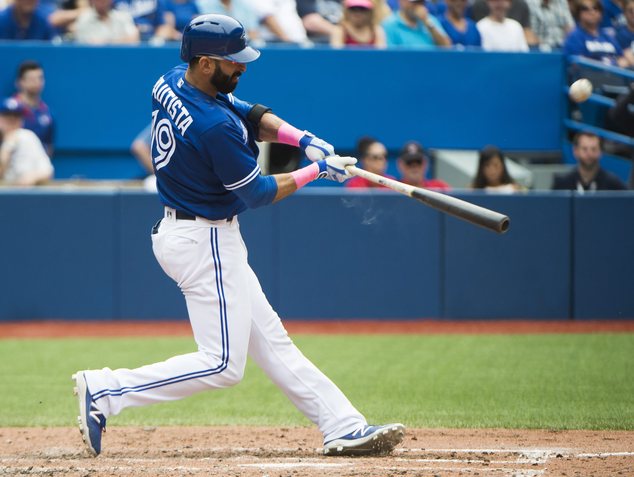 Toronto Blue Jays Jose Bautista connects for a two-run home run against the Boston Red Sox during fifth-inning baseball game action in Toronto on Sunda