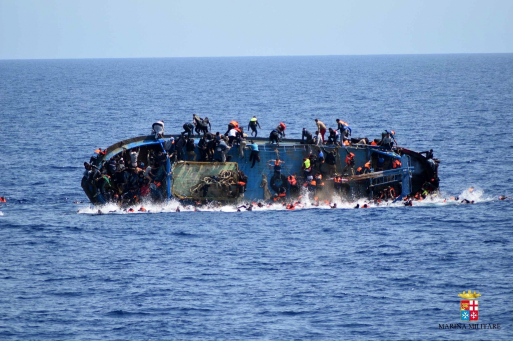 Migrants drown after overcrowded wooden fishing boat 'flips over&#039 in sea near Libya