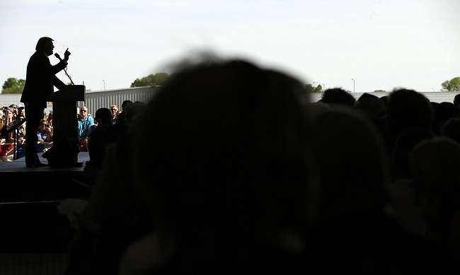 Charlie Neibergall- Republican presidential candidate Donald Trump speaks during a rally Friday