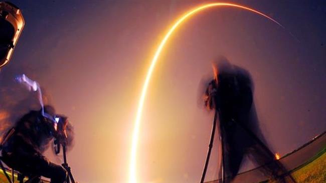 Photojournalists photograph the SpaceX Falcon 9 rocket as it launches on Friday, May 6, 2016 from Cape Canaveral 