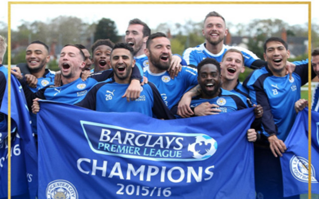 Leicester City players raise Premier League Champions banners