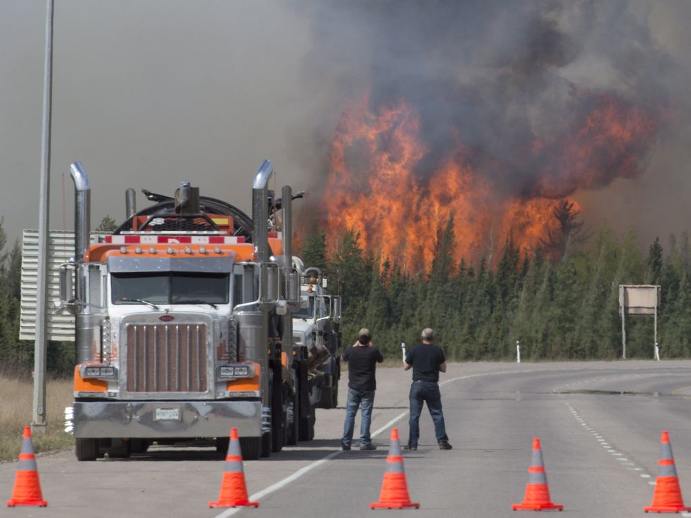 A giant fireball is seen as a wild fire rips through the forest 16 km south of Fort McMurray Alberta on highway 63 Saturday