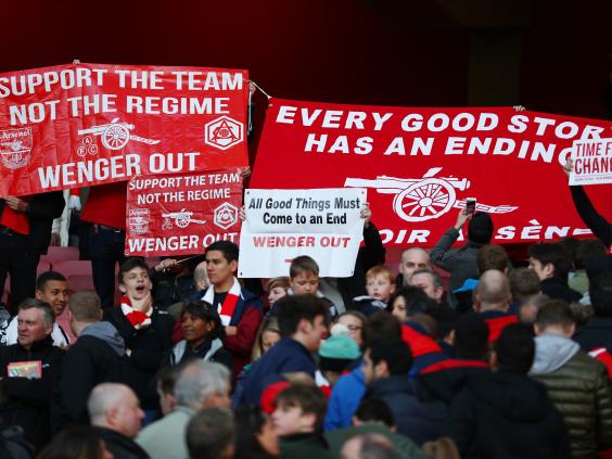 Pockets of support protested against Wenger's management of the team