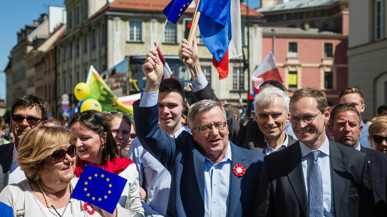 Former Polish President Bronislaw Komorowski, his wife Anna, Berlin Mayor Michael Mueller and other participants march during the annual Schumann Parade to support the idea of a United Europe in Warsaw Poland