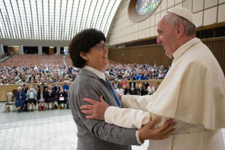 Pope Francis hugs Sister Carmen Sammut a Missionary Sister of Our Lady of Africa at the end of a special audience with members of the International Union of Superiors General in the Paul VI Hall at the Vatican Thursday