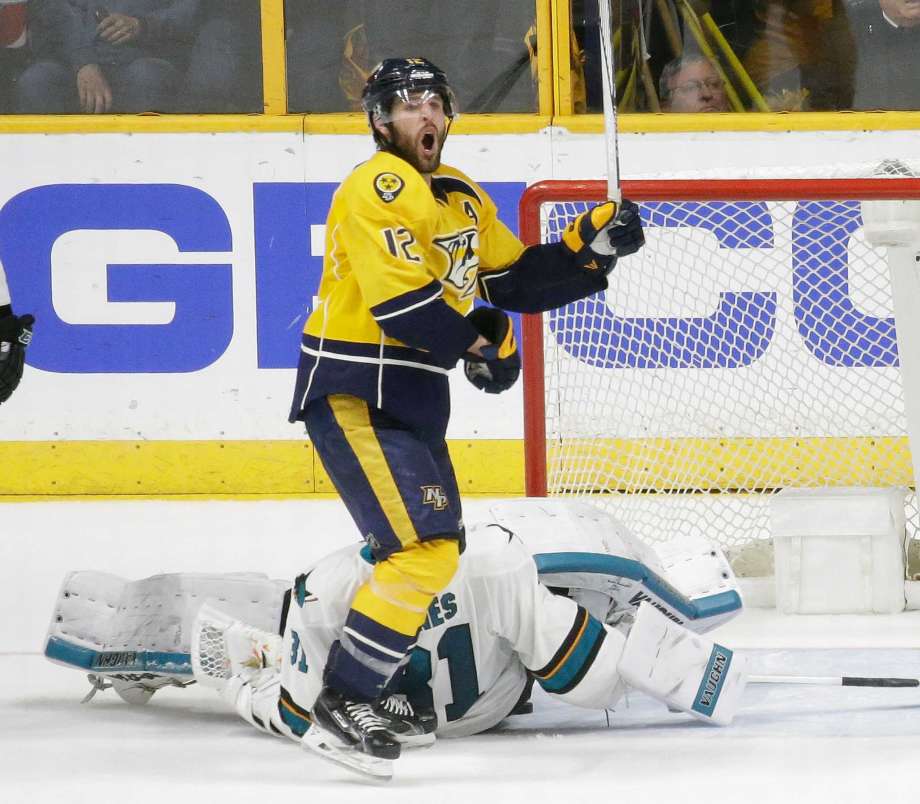 Nashville Predators forward Mike Fisher celebrates after a shot by teammate James Neal not shown got past San Jose Sharks goalie Martin Jones for a goal during the third period in Game 4 of an NHL hockey Stanley Cup Western Conference semifina