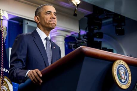 President Barack Obama pauses while speaking in the briefing room of the White House in Washington Friday