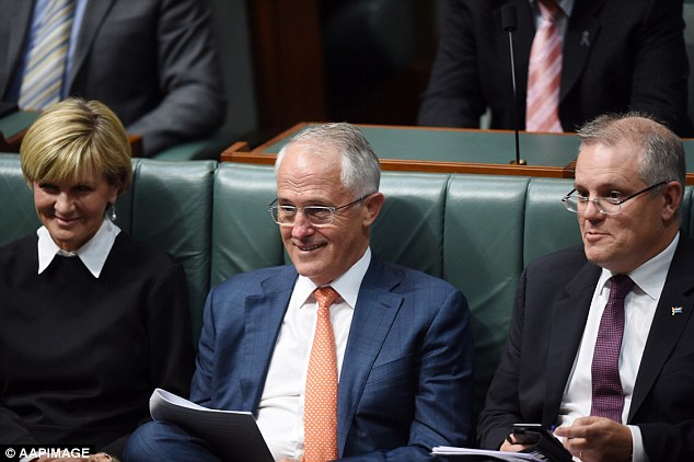 Prime minister Malcolm Turnbull centre enjoys a laugh with Minister for Foreign Affairs Julie Bishop and Treasurer Scott Morrison