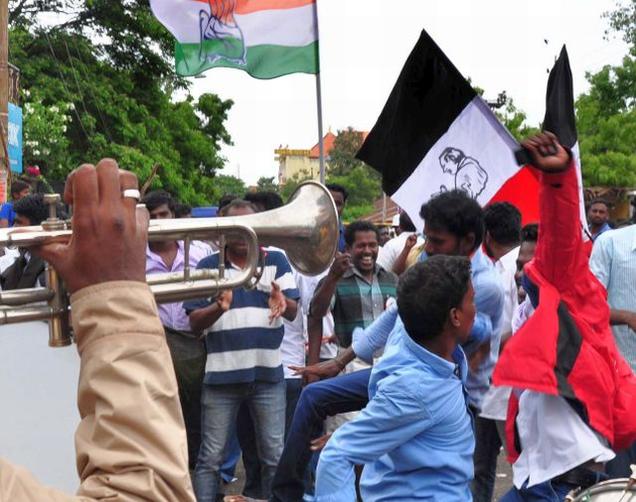 Congress cadre celebrate the victory in Puducherry on Thursday