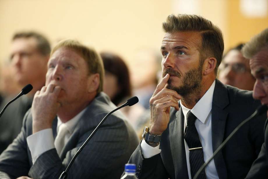 Former soccer player David Beckham right and Oakland Raiders owner Mark Davis left listen at a meeting of the Southern Nevada Tourism Infrastructure Committee Thursday