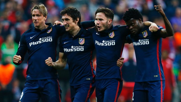 Atletico Madrid players celebrate at fulltime after their 2-1 loss to Bayern Munich