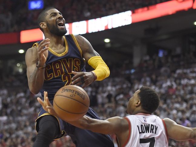 Toronto Raptors Kyle Lowry fouls Cleveland Cavaliers guard Kyrie Irving during fourth quarter Eastern Conference final NBA playoff basketball action against the Cleveland Cavaliers in Toronto on Saturday