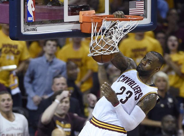 THE CANADIAN PRESS VIA AP           Cleveland Cavaliers forward Le Bron James dunks against the Toronto Raptors during the first half of Game 5 of the NBA basketball Eastern Conference finals today in Cleveland