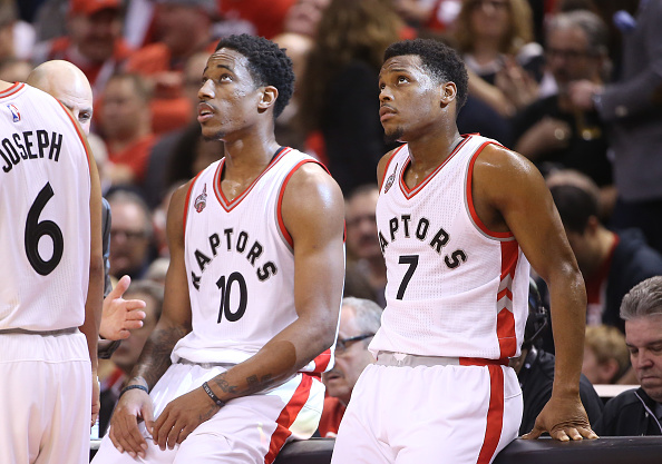 TORONTO CANADA- APRIL 16 Kyle Lowry #7 of the Toronto Raptors and De Mar DeRozan #10 look on against the Indiana Pacers in Game One of the Eastern Conference Quarterfinals during the 2016 NBA Playoffs