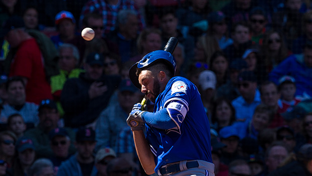 Chris Colabello of the Toronto Blue Jays is hit in the head by a pitch thrown by Steven Wright of the Boston Red Sox