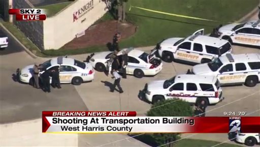 Officers respond to reports of a deadly shooting at the Knight Transportation office in Katy Texas Wednesday