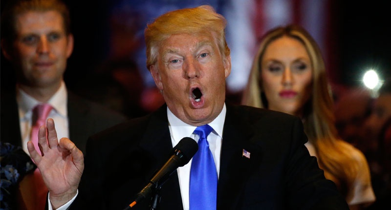 Republican U.S. presidential candidate Donald Trump is surrounded by family members as he speaks during a campaign victory party after rival candidate Senator Ted Cruz dropped out of the race for the Republican presidential nomination following the result