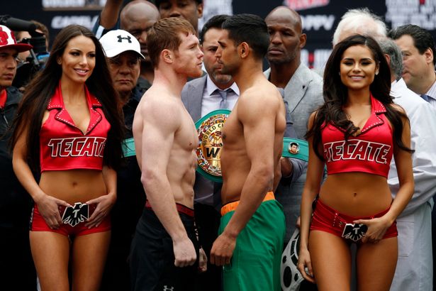 Amir Khan and Saul 'Canelo&#039 Alvarez during the weigh