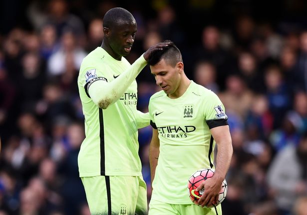 Yaya Toure congratulates Sergio Aguero on his third goal