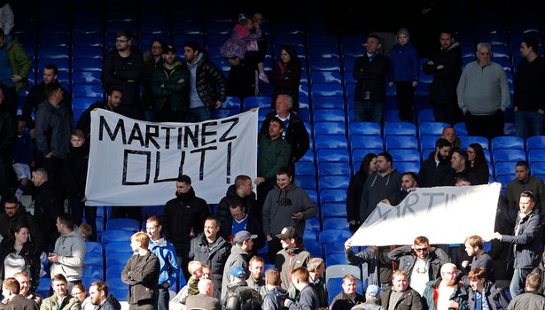 Everton fans with a banner regarding Everton manager Roberto Martinez