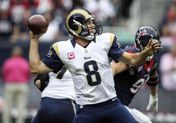 Sam Bradford attempts a pass