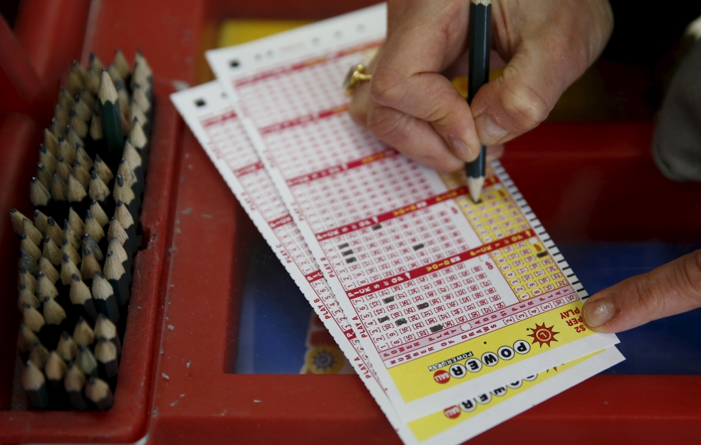 ReutersA person filling out numbers on a Powerball ticket at Talbert's Ice & Beverage Service in Bethesda Maryland on January 8