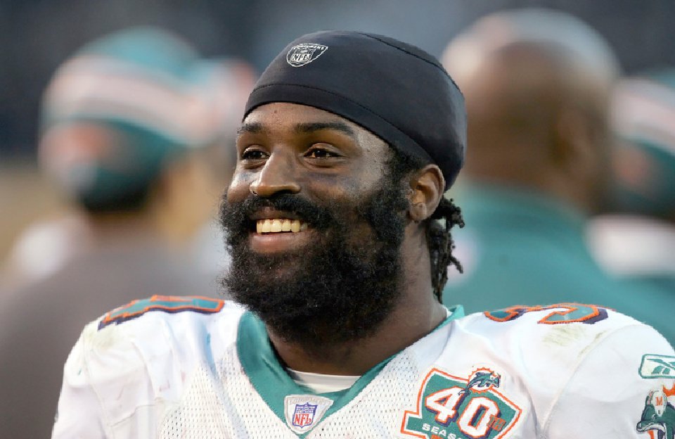 Ricky Williams smiles in the final seconds of Miami's 33-21 win over the Oakland Raiders on Sunday Nov. 27 2005 in Oakland Calif